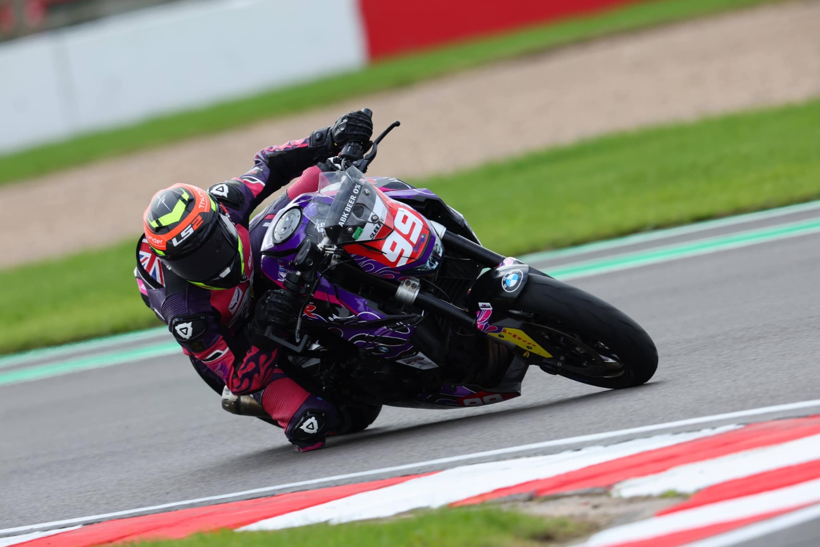 Motorcycle racer leaning through a corner