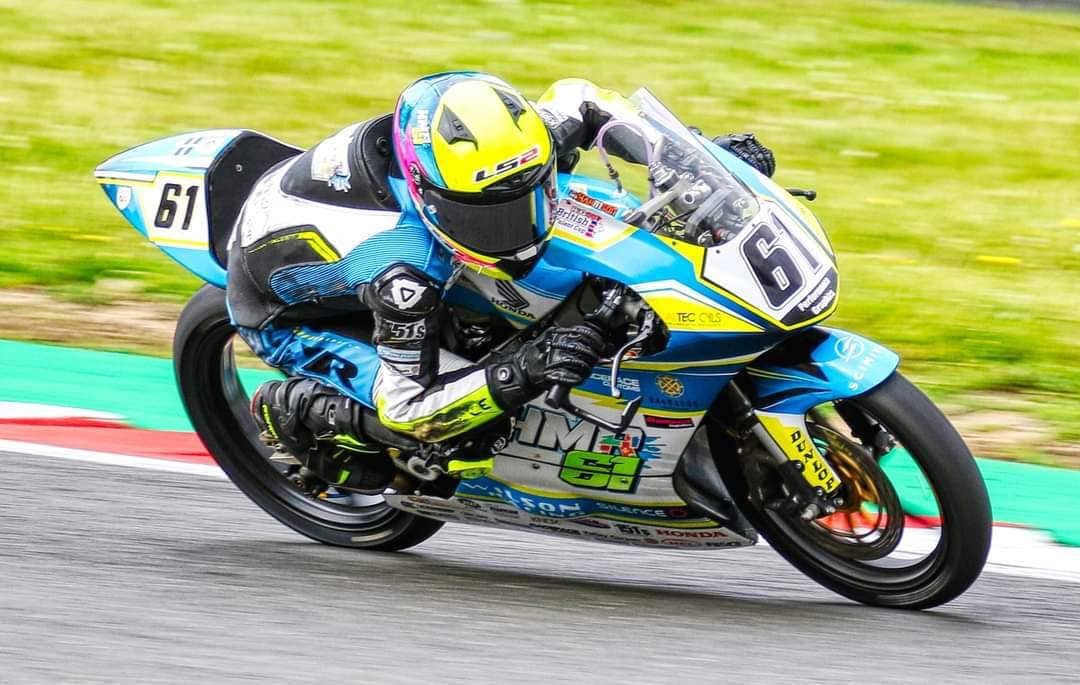 NFmoto rider on track in a custom leather race suit