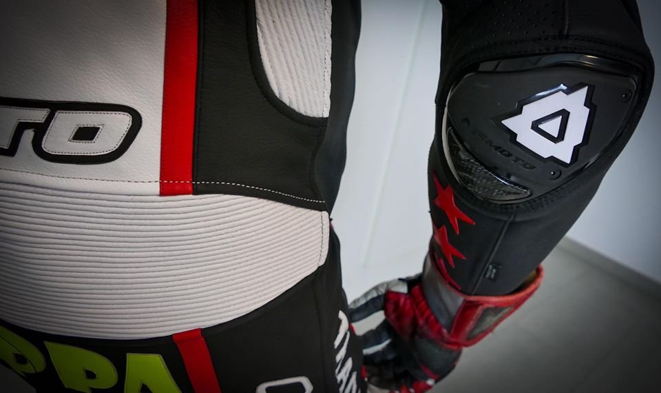 NFmoto rider on track in a custom leather race suit