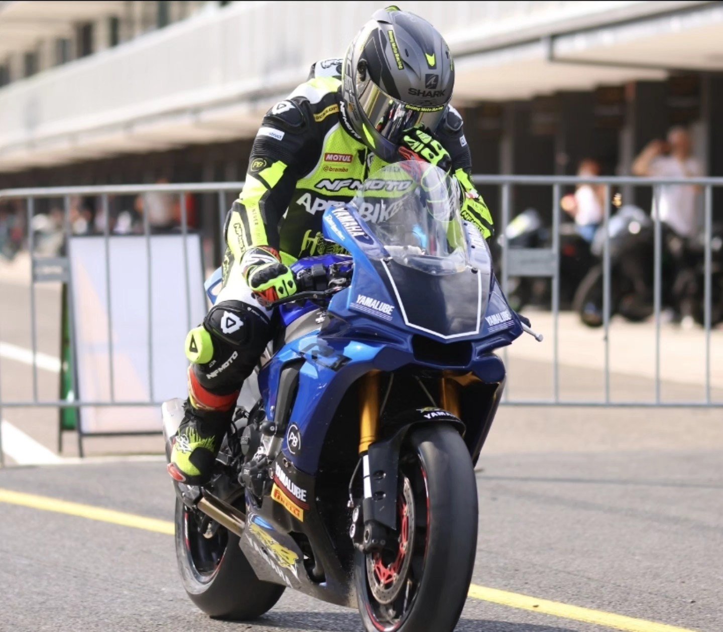 Rider wearing a custom NFmoto leather race suit
